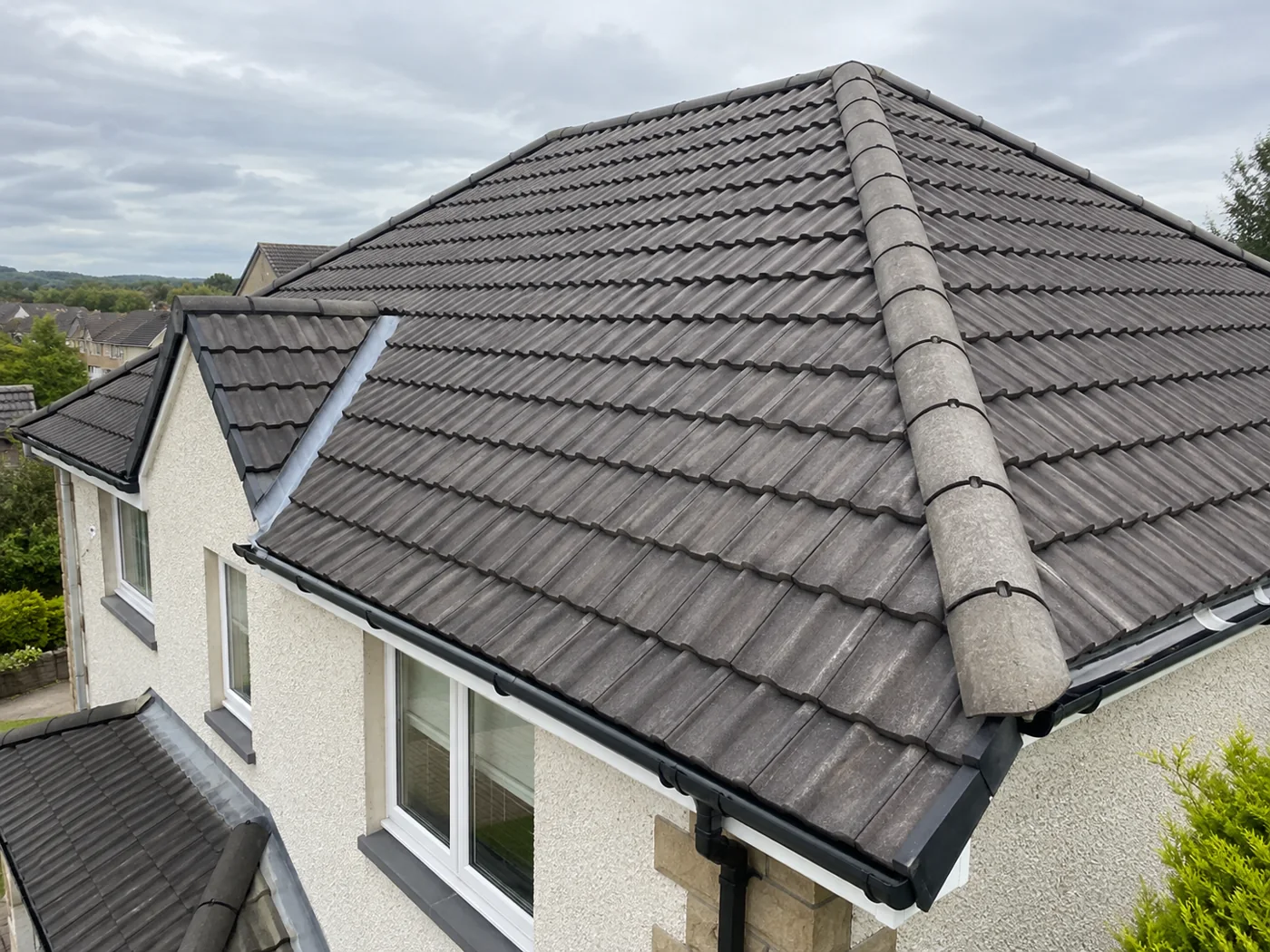 Interlocking tiled domestic roof and ridge